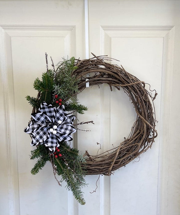 Grapevine wreath with a simple swag of fraser fir and 